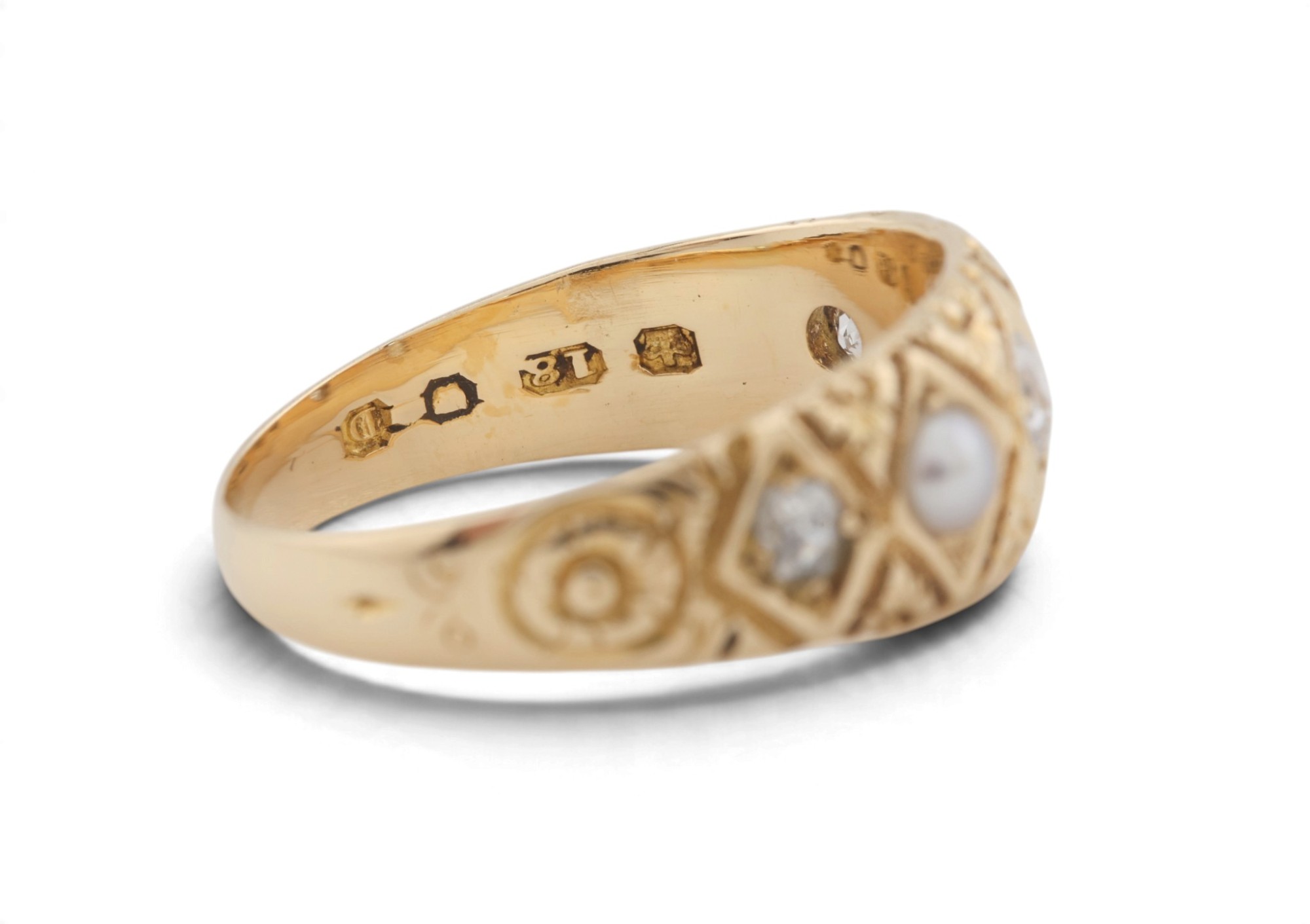 London hallmarks for 1879 struck inside an 18 carat gold ring set with a pearl and diamonds