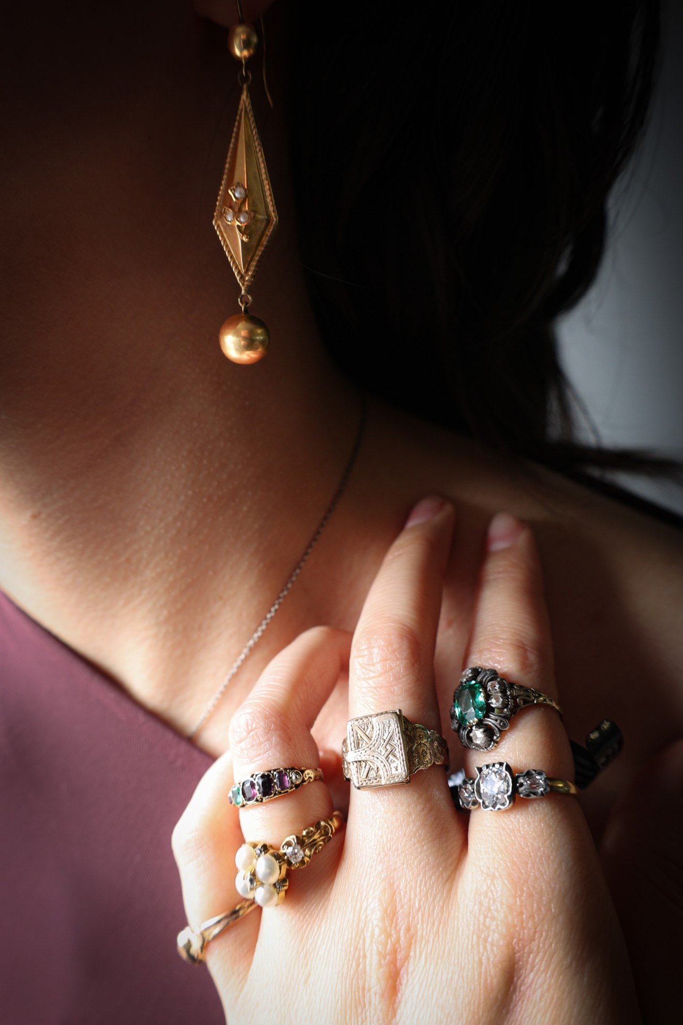 Antique rings worn stacked across the hand