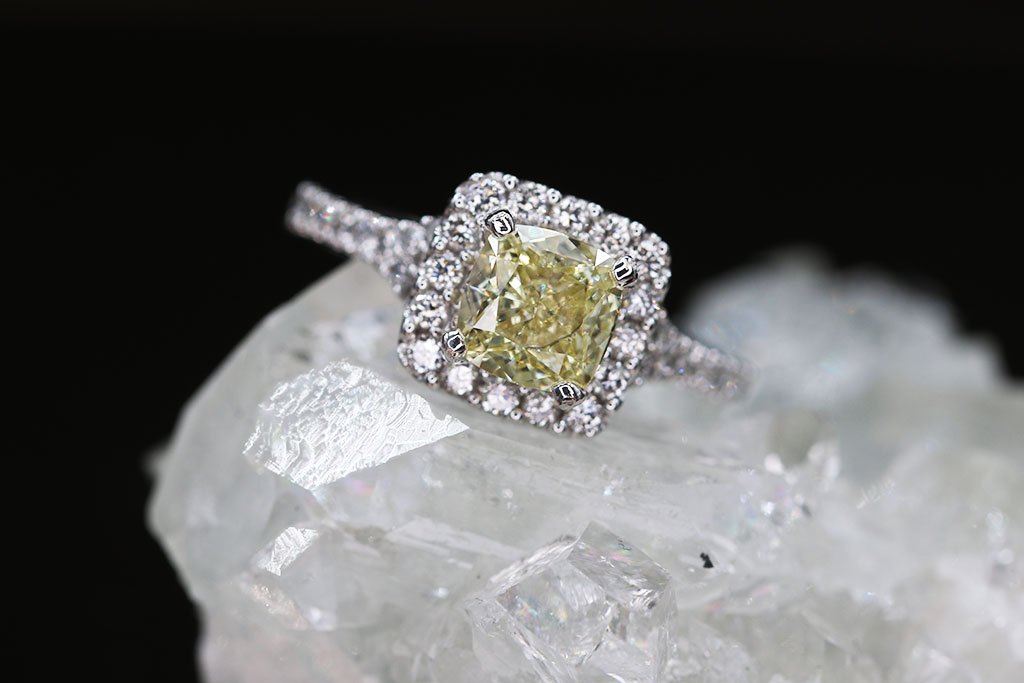 A yellow diamond halo ring on a quartz crystal
